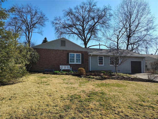 view of front of home with a front yard, an attached garage, brick siding, and concrete driveway