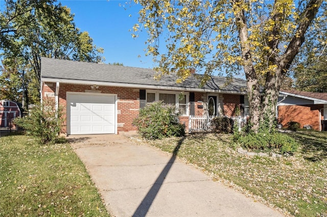 ranch-style home featuring brick siding, a porch, an attached garage, driveway, and a front lawn