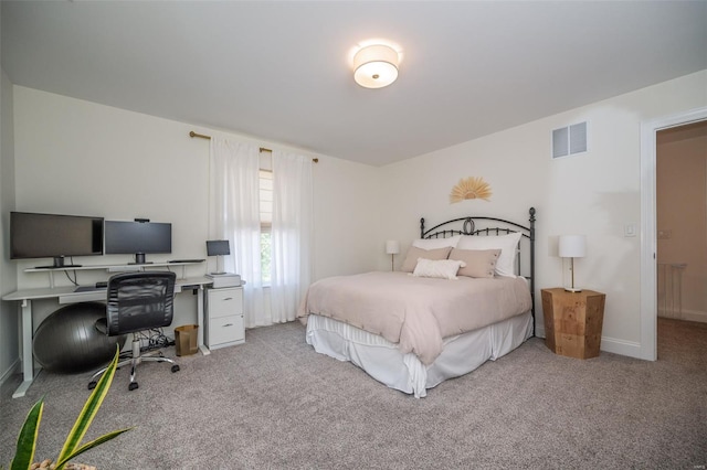 carpeted bedroom with baseboards and visible vents