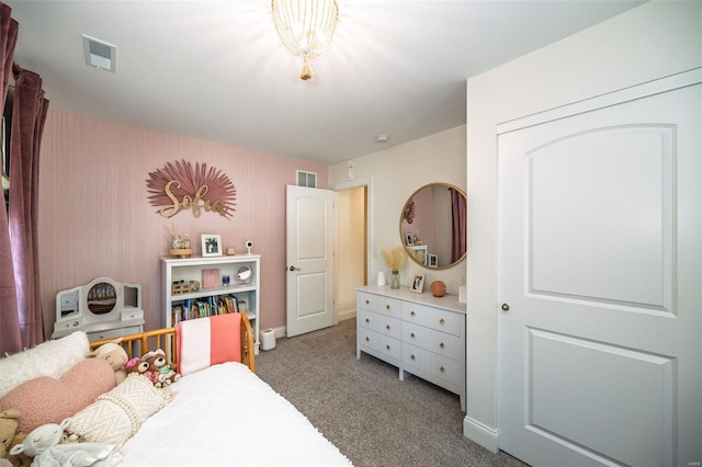 bedroom featuring carpet floors, baseboards, and visible vents