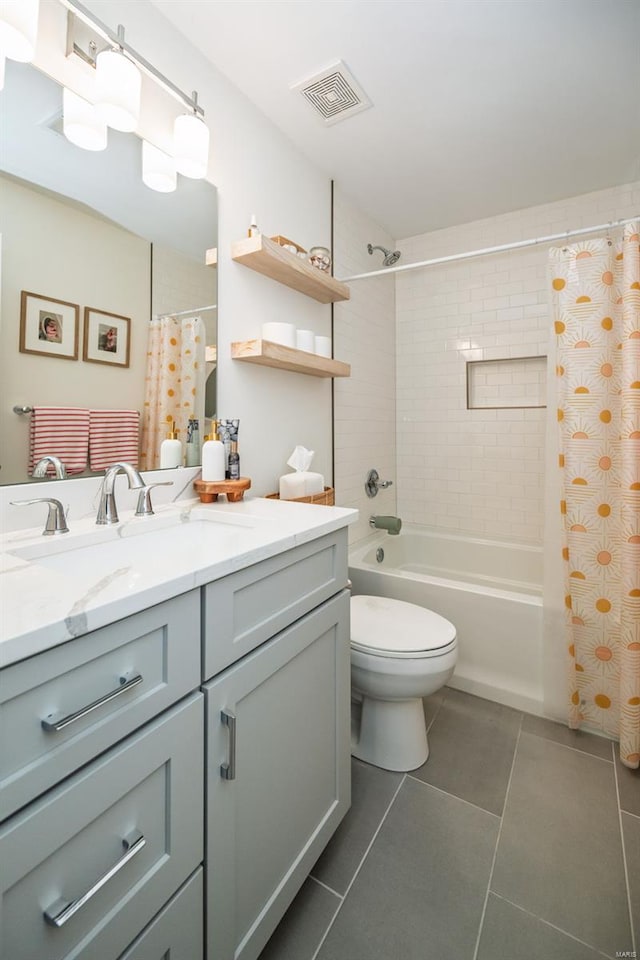 full bathroom featuring visible vents, shower / bath combo with shower curtain, tile patterned flooring, vanity, and toilet