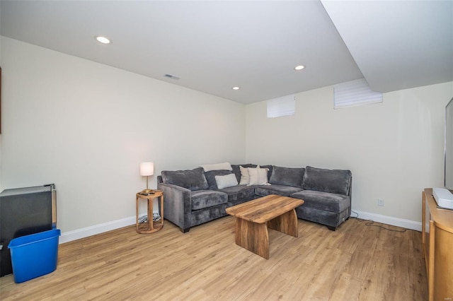 living room featuring visible vents, recessed lighting, light wood-style flooring, and baseboards