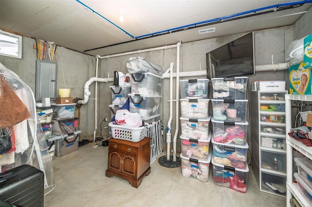 storage area featuring electric panel and visible vents