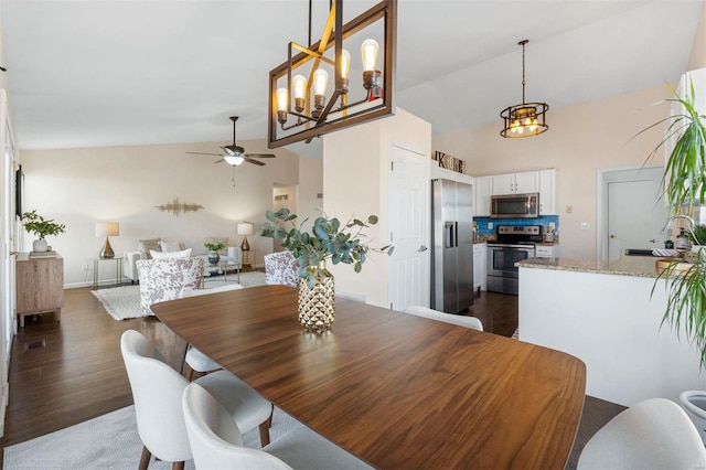 dining space with dark wood-type flooring, high vaulted ceiling, and ceiling fan