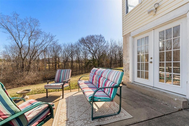 view of patio / terrace with french doors and fence