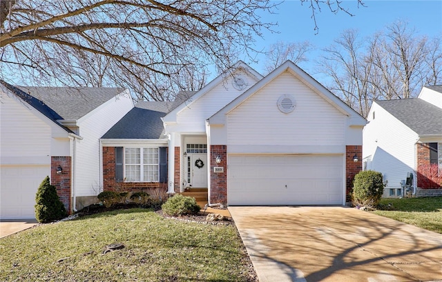 ranch-style house with concrete driveway, brick siding, and an attached garage