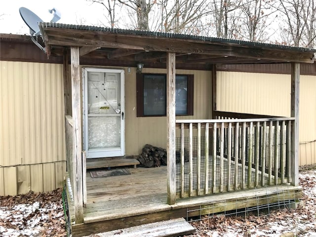 view of snow covered property entrance