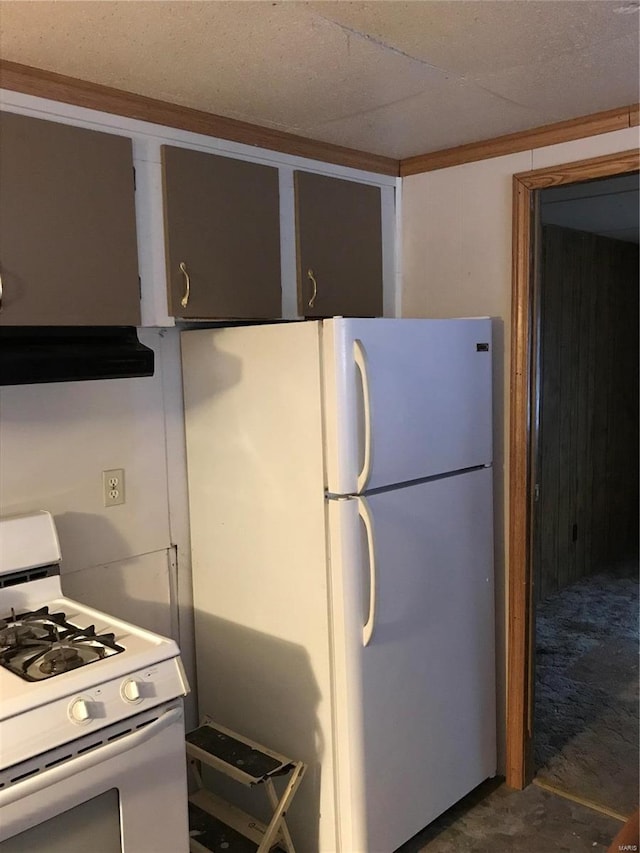 kitchen with white appliances and extractor fan