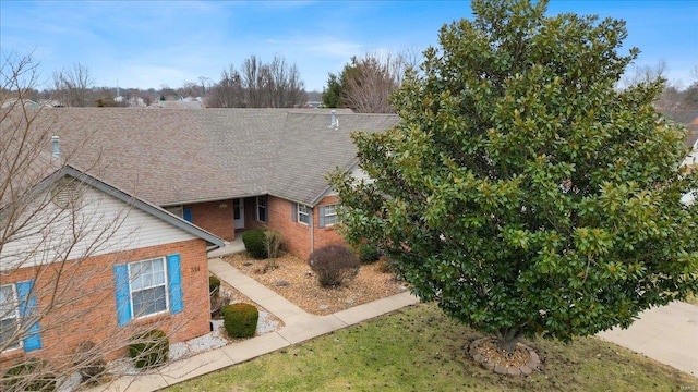 view of front of property featuring brick siding