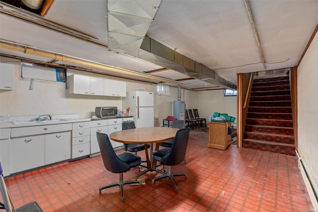 dining space with stairs, a toaster, a baseboard radiator, water heater, and tile patterned floors