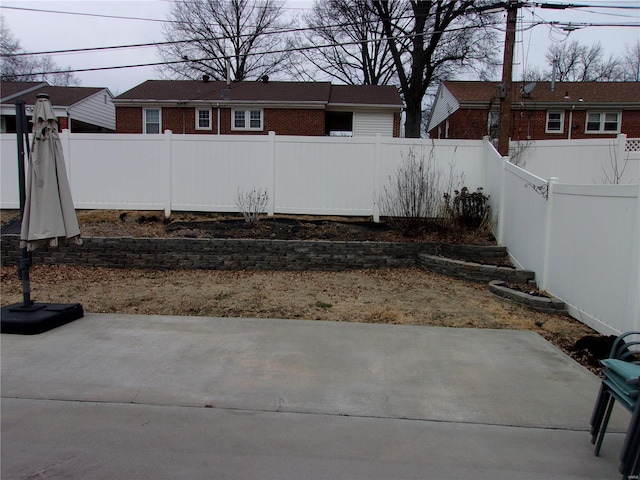 view of yard featuring a patio area and a fenced backyard