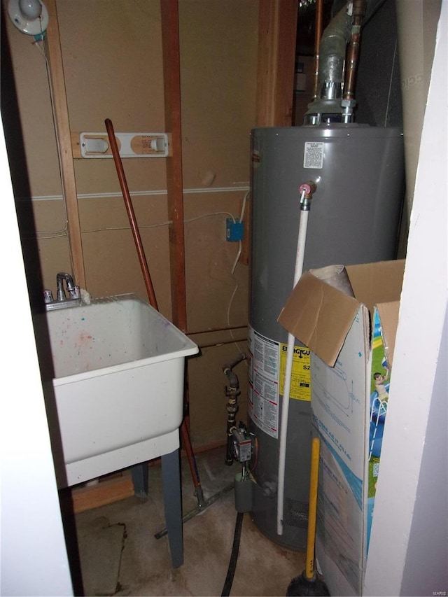 utilities featuring a sink and gas water heater