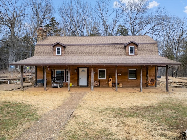 dutch colonial with roof with shingles