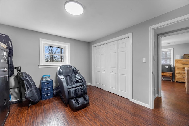 home office with baseboards and wood finished floors