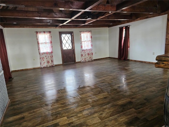 interior space featuring dark wood-style floors and baseboards