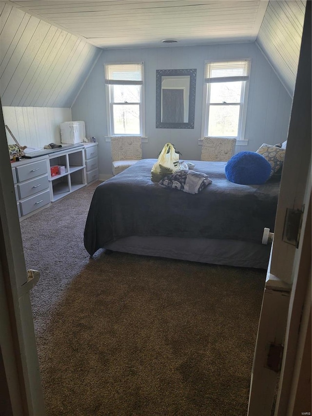 carpeted bedroom featuring wooden ceiling and vaulted ceiling