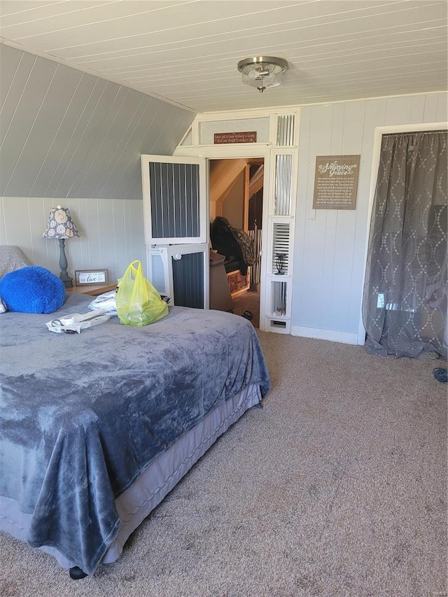 carpeted bedroom with vaulted ceiling