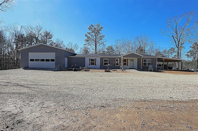 view of front of home featuring driveway and a garage