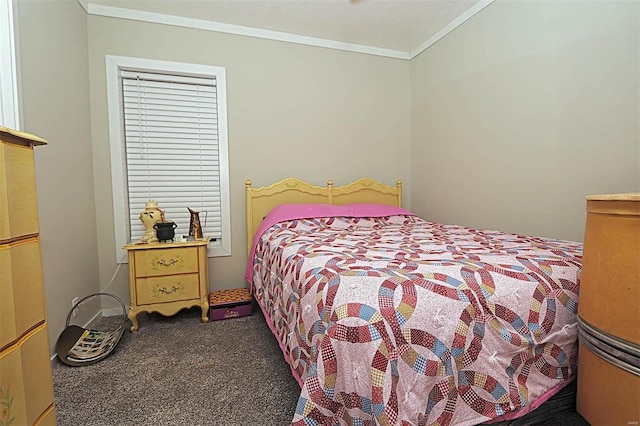 bedroom with ornamental molding and dark colored carpet