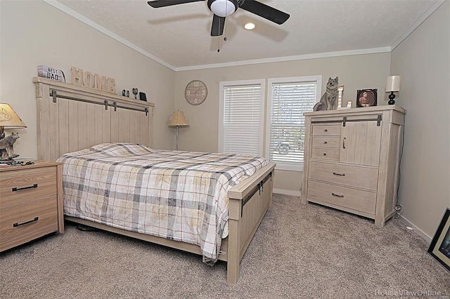 bedroom featuring baseboards, ornamental molding, a textured ceiling, and light colored carpet