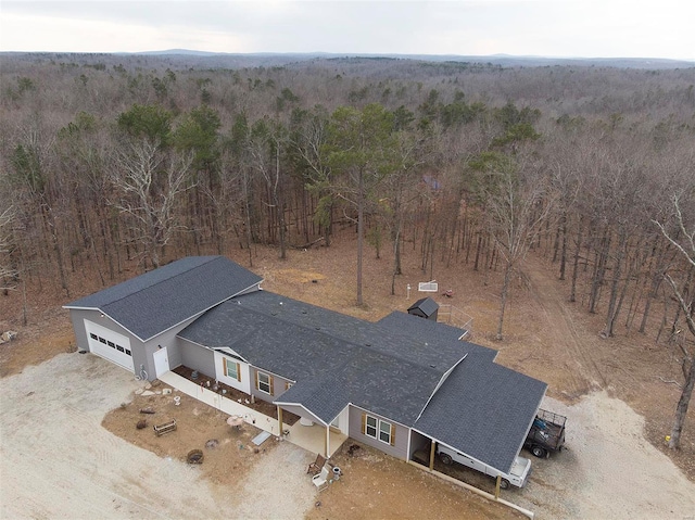 bird's eye view featuring a forest view