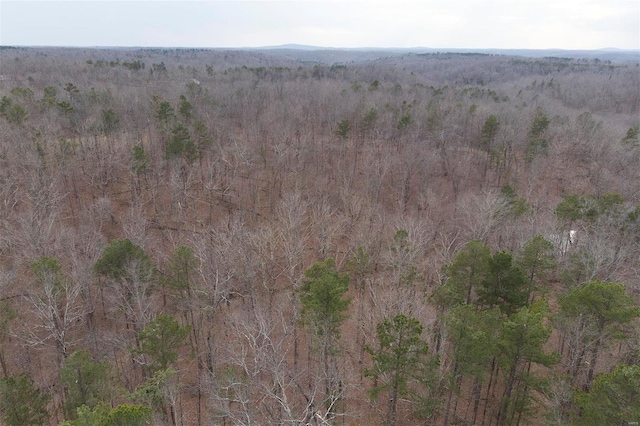 birds eye view of property with a view of trees