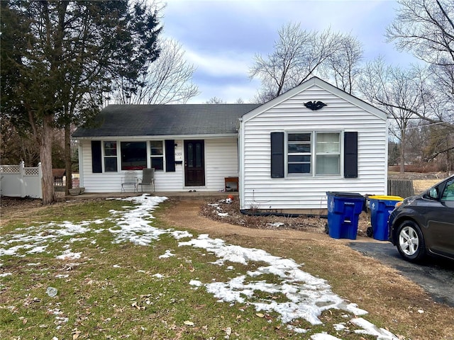 single story home featuring fence