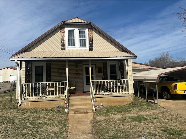 view of front of house with a porch and metal roof