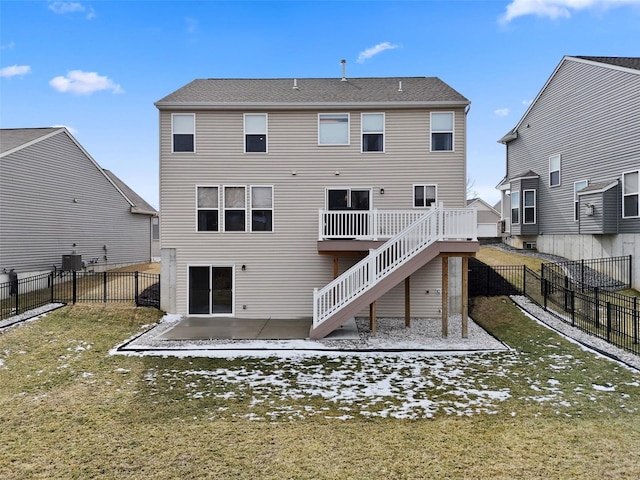 back of property featuring a lawn, a fenced backyard, stairs, a patio area, and central AC