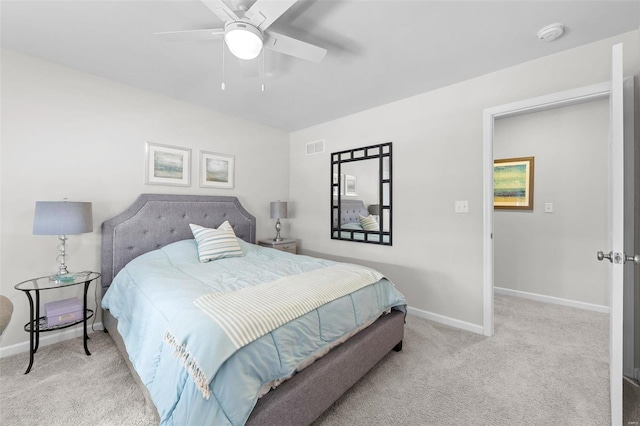 bedroom featuring light carpet, baseboards, visible vents, and ceiling fan