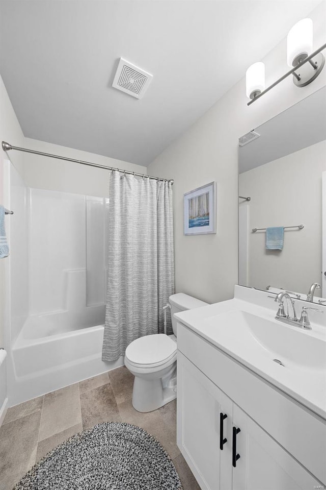 bathroom featuring toilet, visible vents, shower / bath combo with shower curtain, and vanity