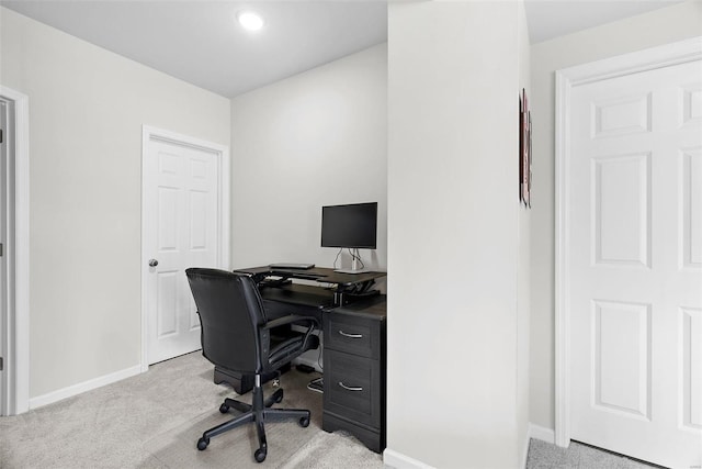 office featuring light carpet and baseboards