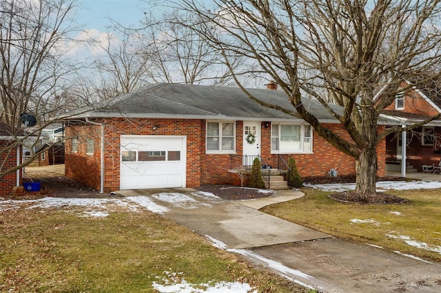 ranch-style house featuring a garage, driveway, a lawn, and brick siding