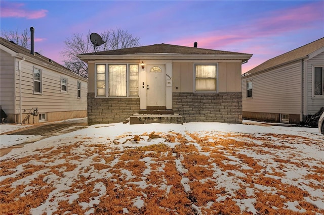 view of front of property with stone siding and board and batten siding