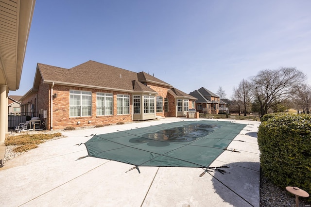 view of pool with a fenced in pool and a patio