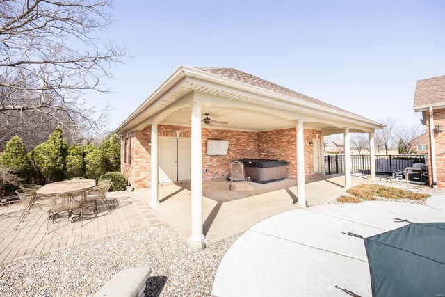 view of patio / terrace with ceiling fan, outdoor dining space, and fence