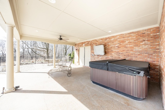 view of patio / terrace with a ceiling fan and an indoor hot tub