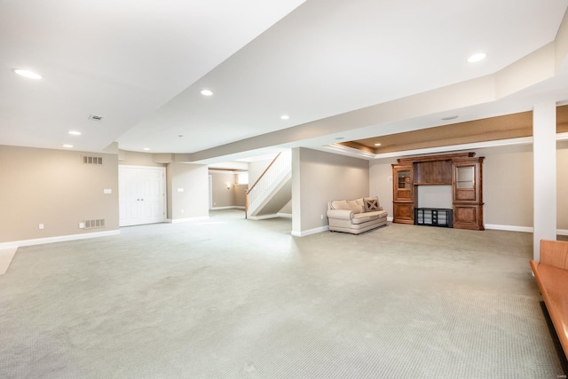 interior space with light carpet, visible vents, recessed lighting, and stairway