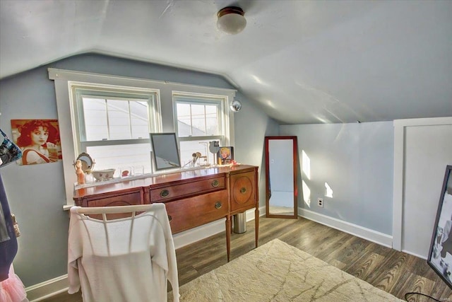 office area featuring lofted ceiling, wood finished floors, and baseboards