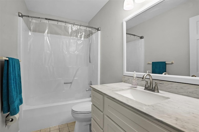 bathroom featuring toilet, vanity, tile patterned flooring, and shower / bath combo with shower curtain