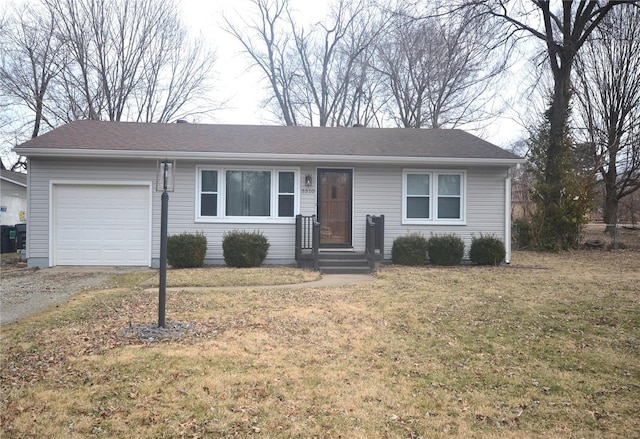 ranch-style house with a garage, a front lawn, and aphalt driveway