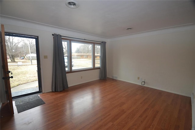 interior space featuring wood finished floors and visible vents