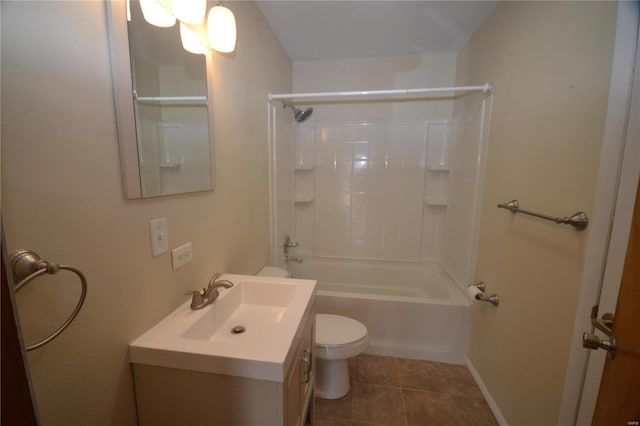 bathroom with baseboards, toilet, vanity, tile patterned floors, and shower / bathtub combination