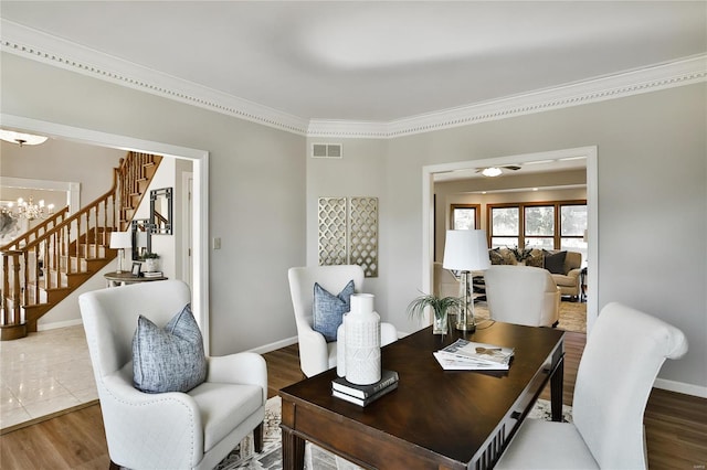 office area featuring ornamental molding, wood finished floors, visible vents, and baseboards