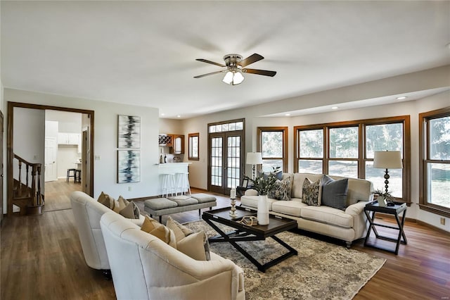 living area featuring recessed lighting, a ceiling fan, baseboards, stairs, and dark wood-style floors