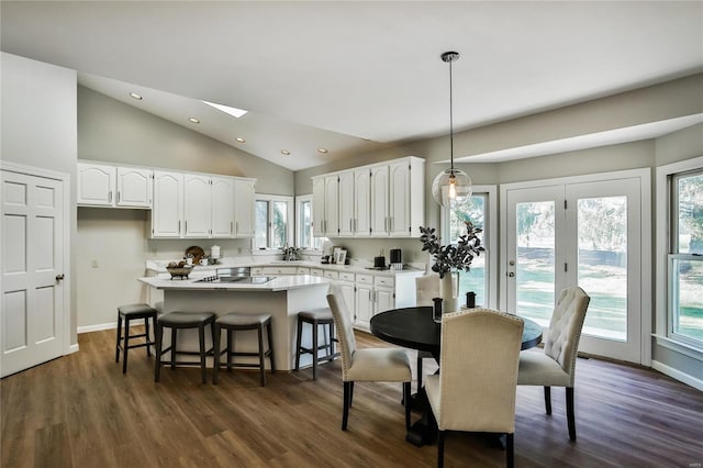 dining area with dark wood-style floors, baseboards, and recessed lighting