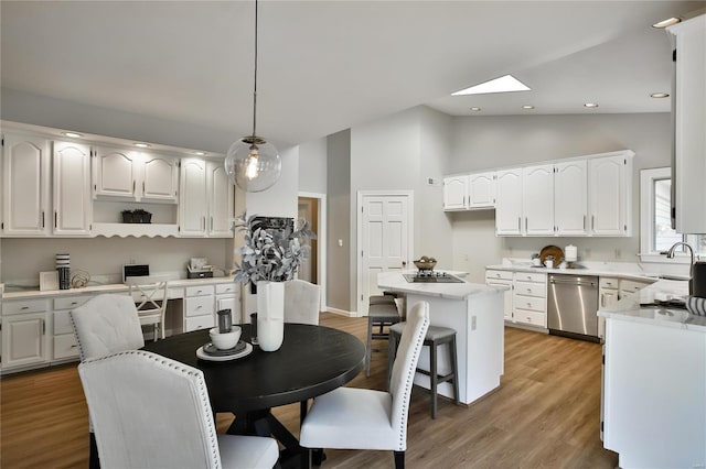 dining area featuring light wood-style flooring, high vaulted ceiling, and recessed lighting