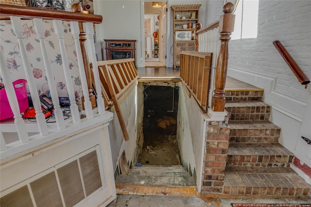 stairway with brick wall