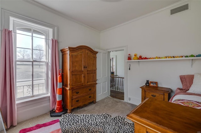 bedroom with light carpet, visible vents, and ornamental molding