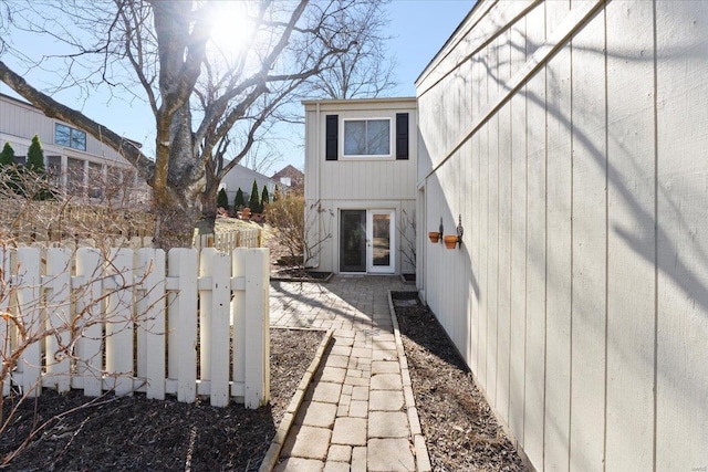 view of property exterior with fence